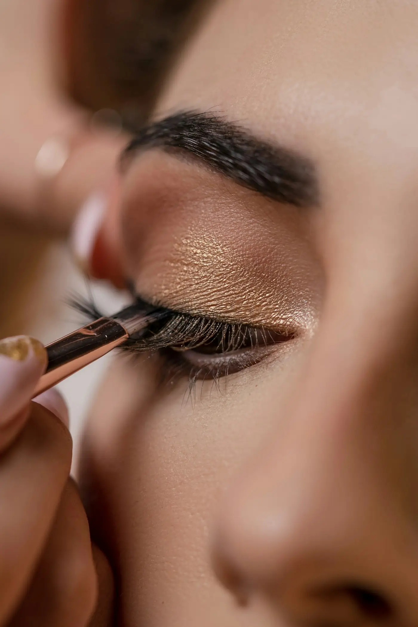 Artist applying eye makeup