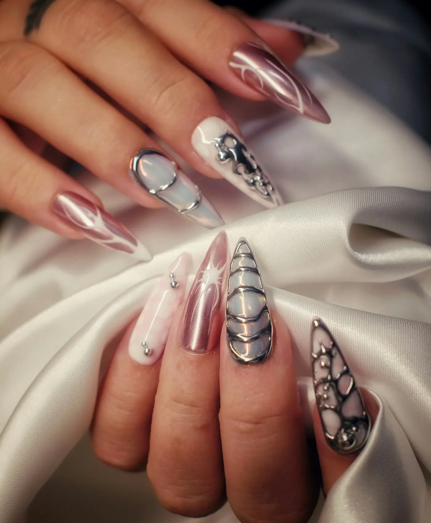 Chrome and jewelled almond nail art